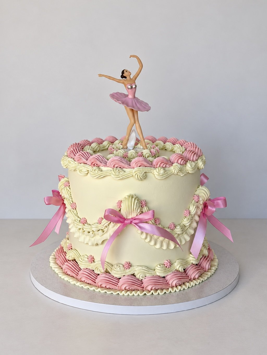 Vintage cake with a ballerina and pink ribbons
